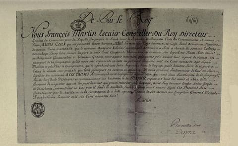Photographic facsimile of the French pass of the Quedagh Merchant. A handwritten French document headed De Par le Roy, opening Nous Francois Martin Escuier Conseiller du Roy Directeur, with two seals at left and the signature Martin. The enclosure mark 64(iii) appears at the top right corner.