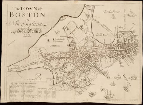 John Bonner's 1722 map of Boston, the hilly peninsula drawn in plan with its named streets and its three hills shown in perspective, the harbour edge crowded with wharves, shipyards and ropewalks and Long Wharf projecting far out into the water.